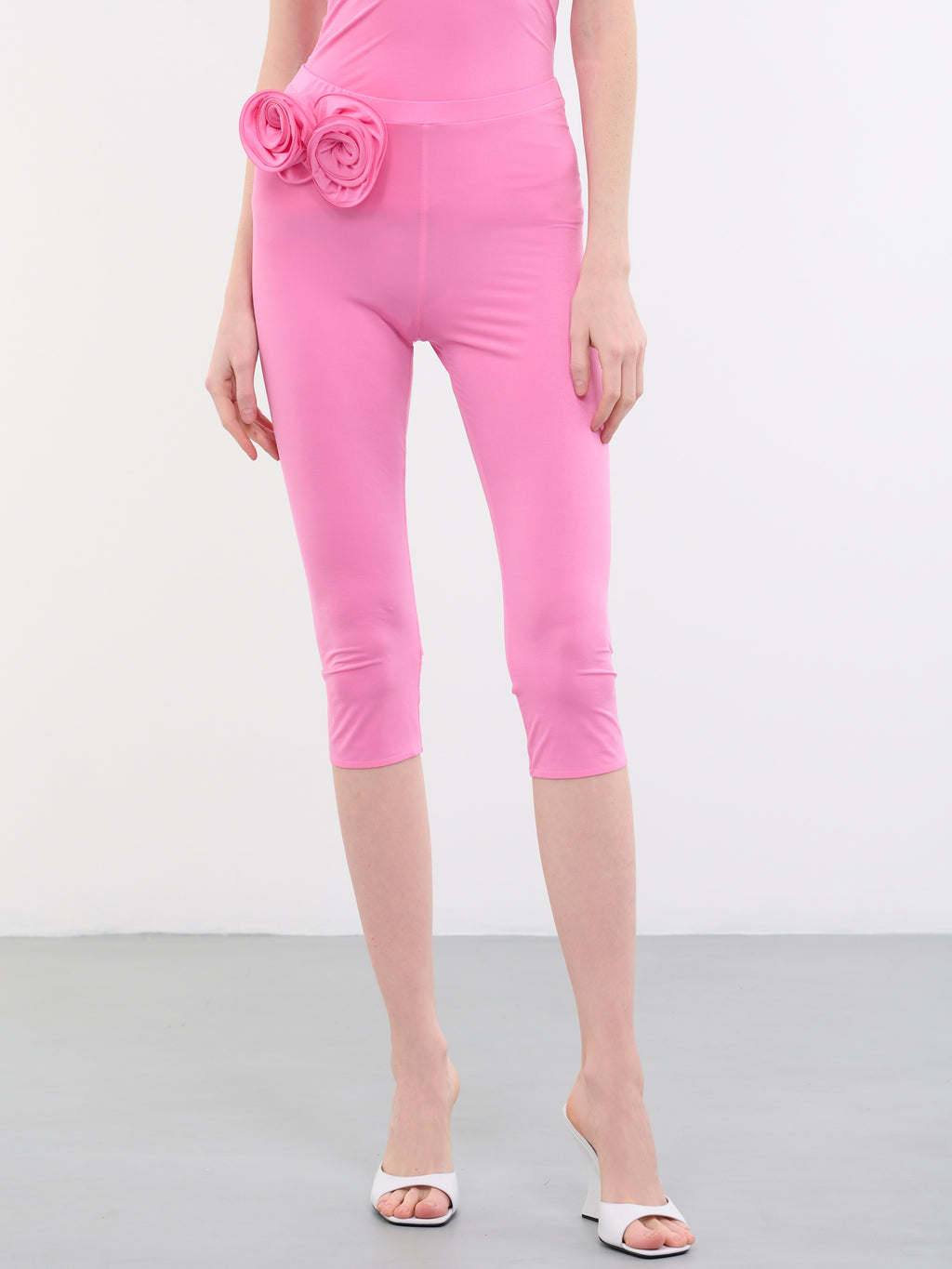 High-rise faux fur-trimmed leggings in pink - Magda Butrym